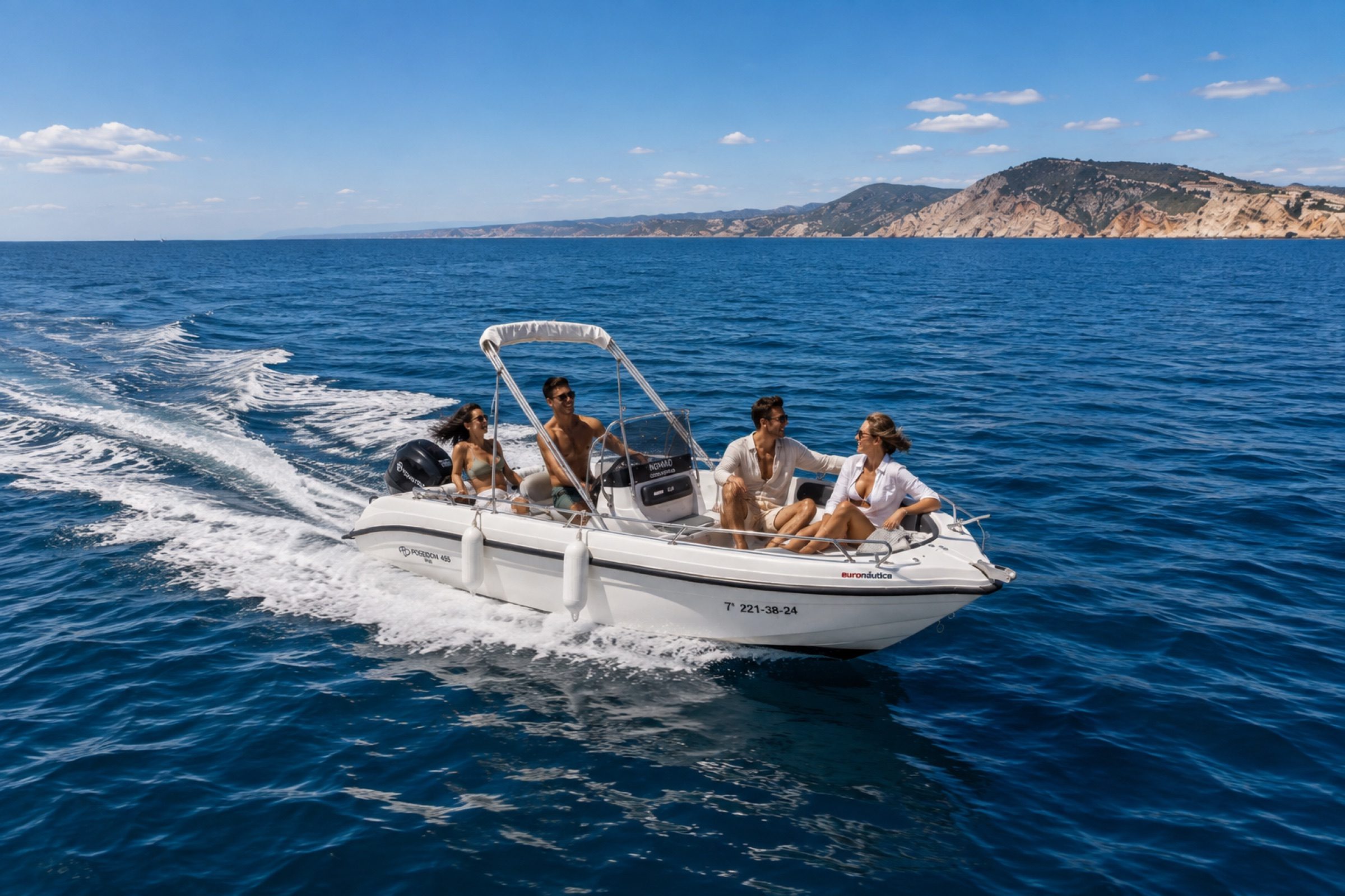 The boat cruising along a rocky coastline under a bright sky